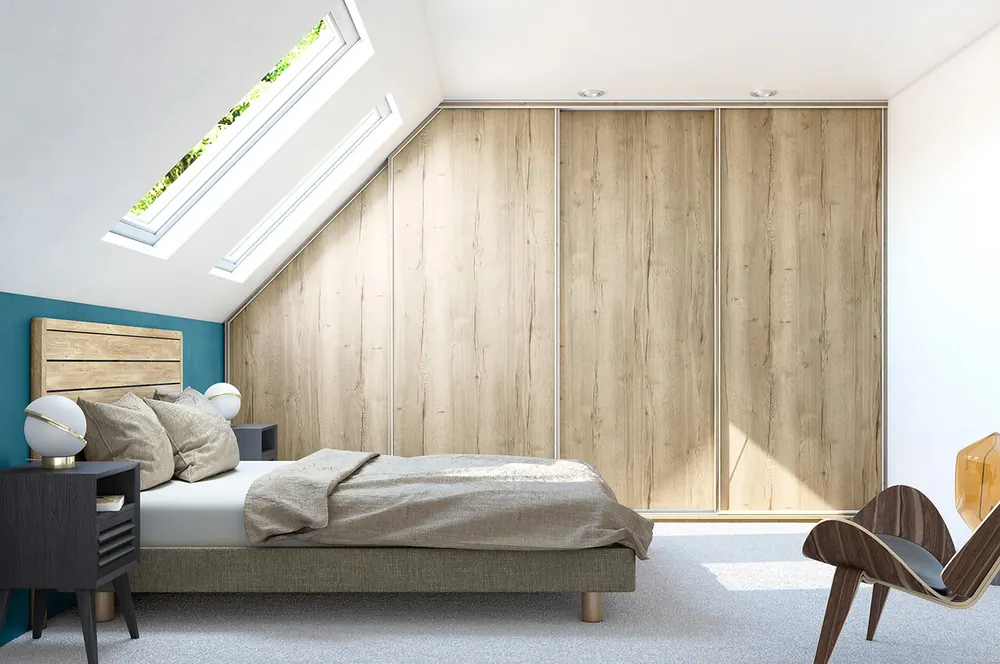 Chambre sur mesure rangement mansardé — décor bois, aménagé par Gitter à Hagondange (gammes Portéa)
